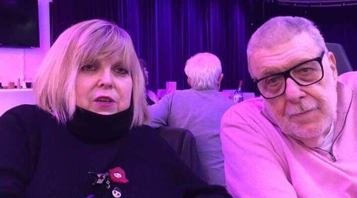 Barbara and Mike sit together at an event, a lovely informal photo of two friends