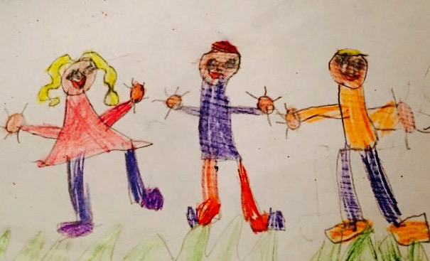 Drawing by a child. Three children playing together on the grass. They are wearing brightly coloured clothes and look cheerful.
